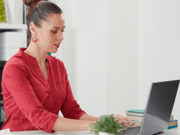 woman at desk with computer