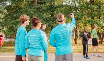 family taking a selfie in their race shirts